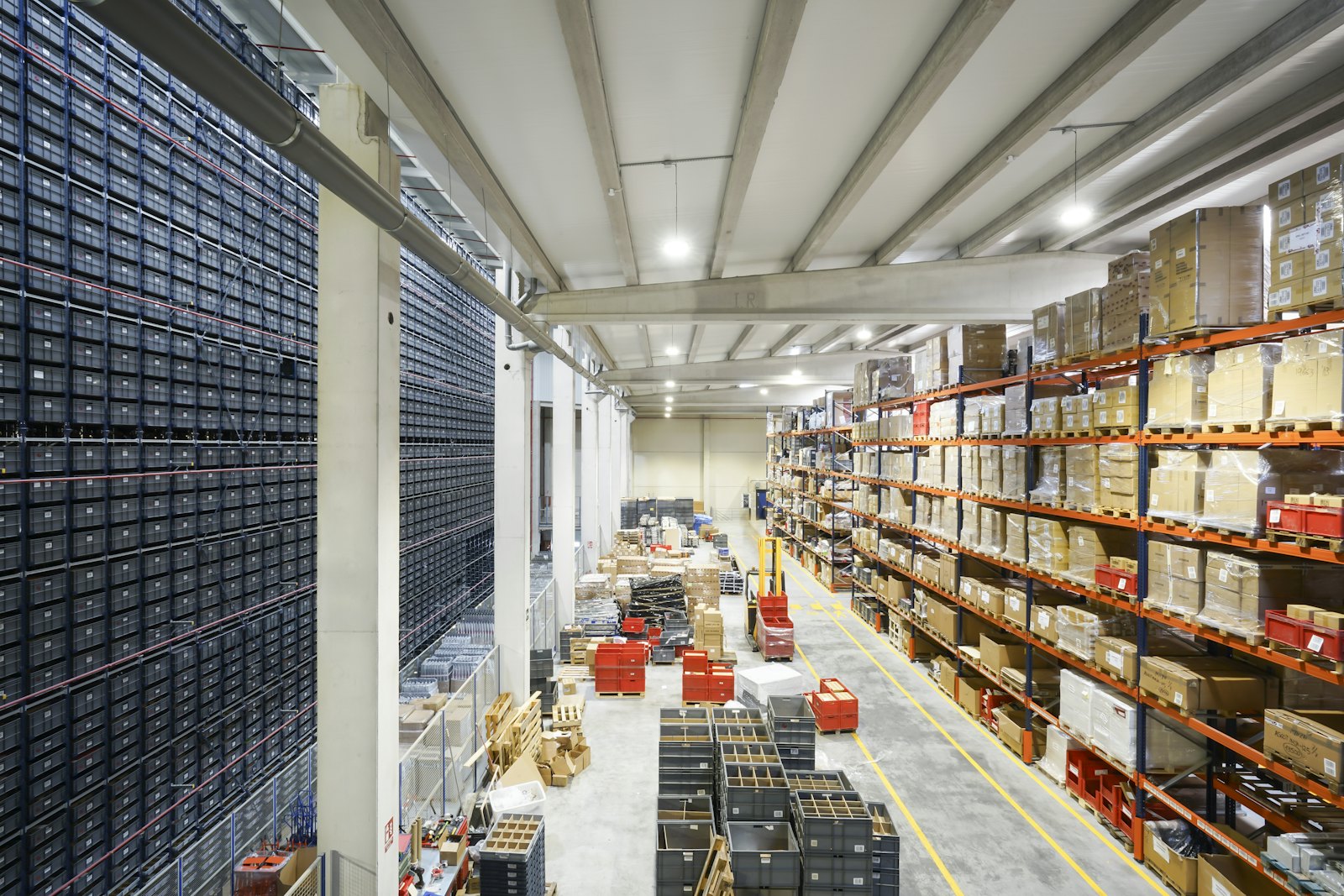 Organised warehouse racking stacked with palletised stock